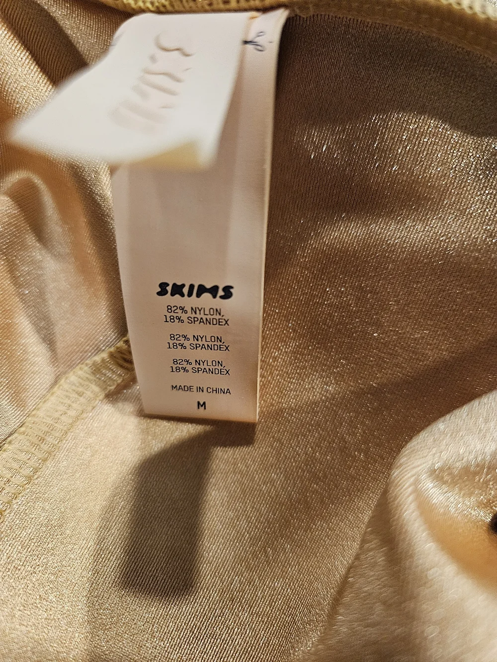 SKIMS Gold Knot-Front Metallic Swim Coverup Skirt